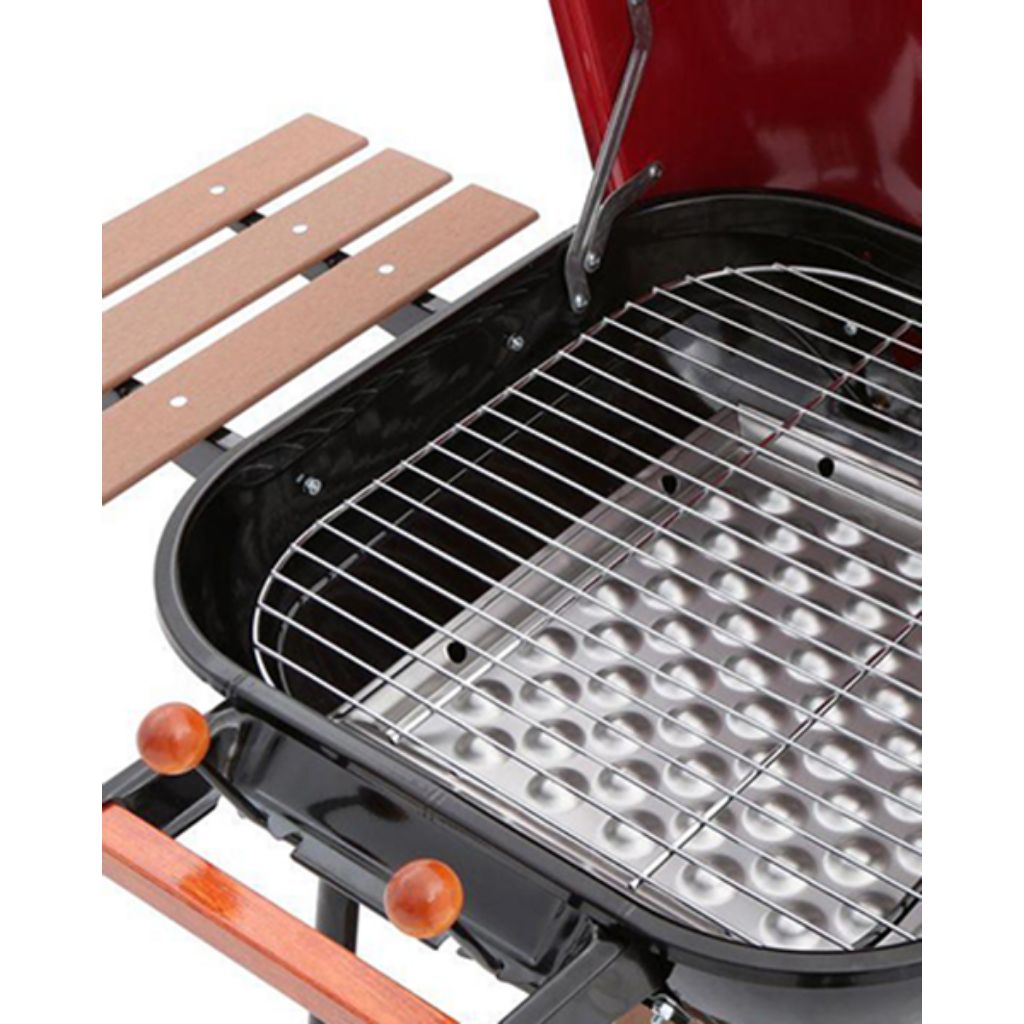 Red Americana Swinger charcoal grill with two folding wooden side tables – view 2
