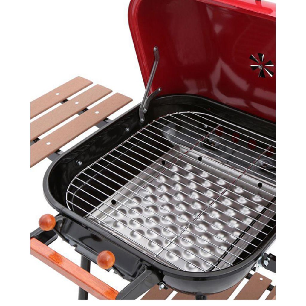 Red Americana Swinger charcoal grill with wooden side tables and bottom shelf – view 2
