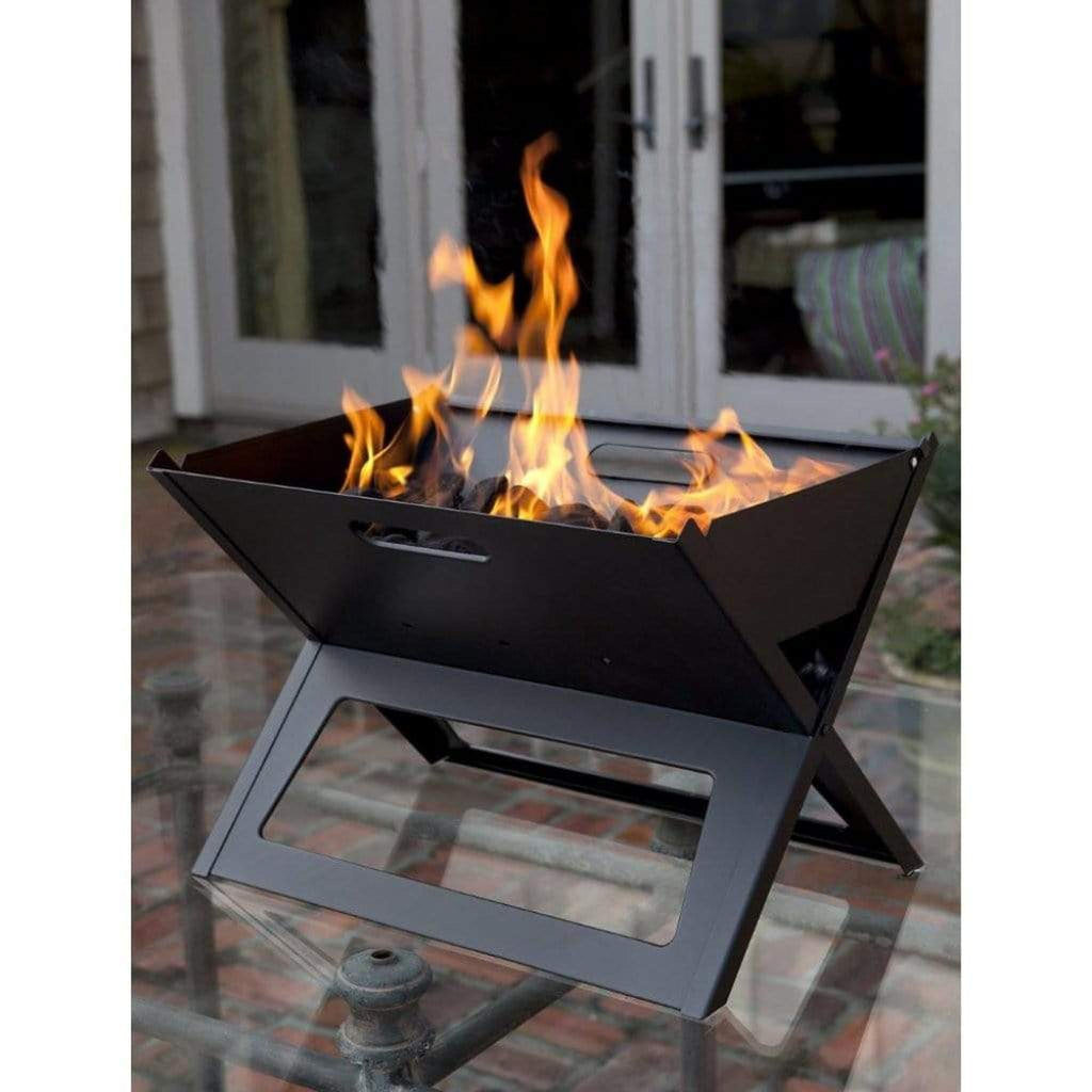 Fire Sense Notebook portable charcoal grill folded open on a table – view 2