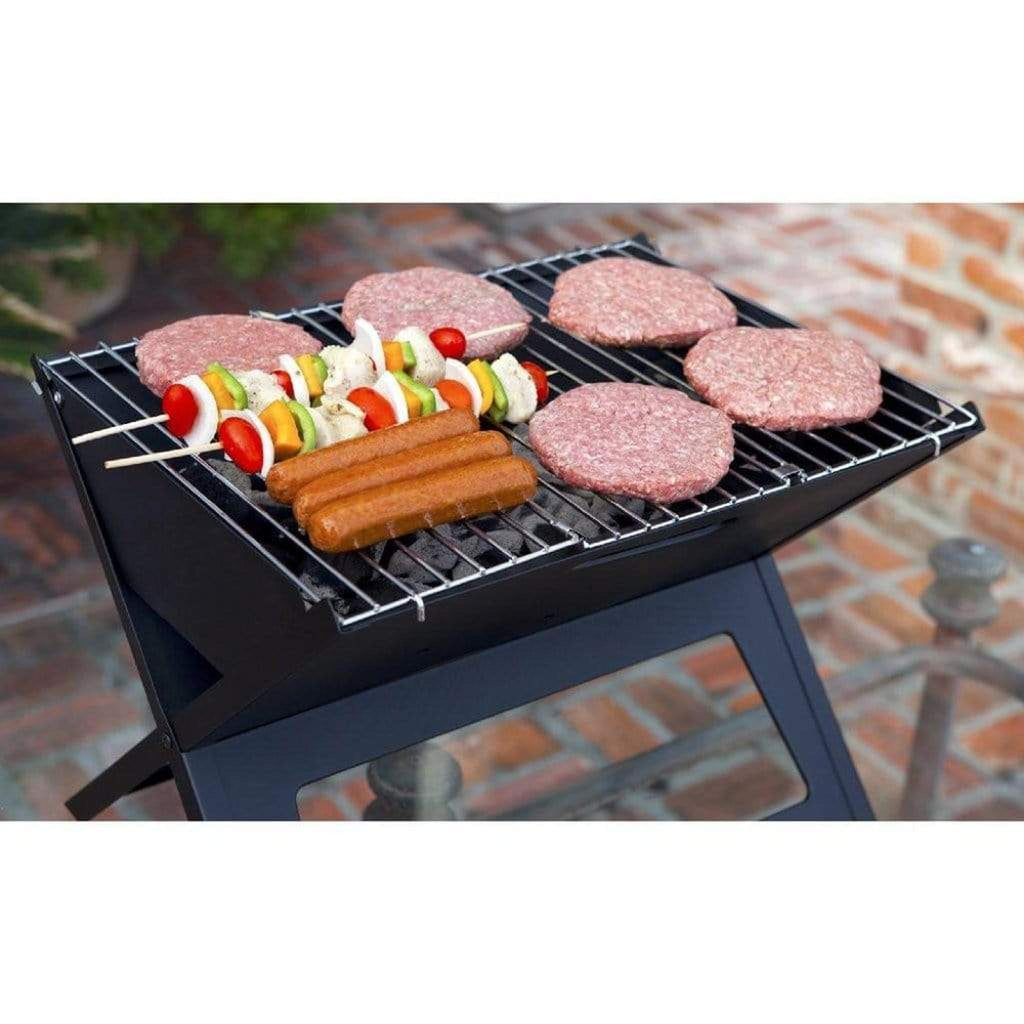 Fire Sense Notebook portable charcoal grill folded open on a table – view 4