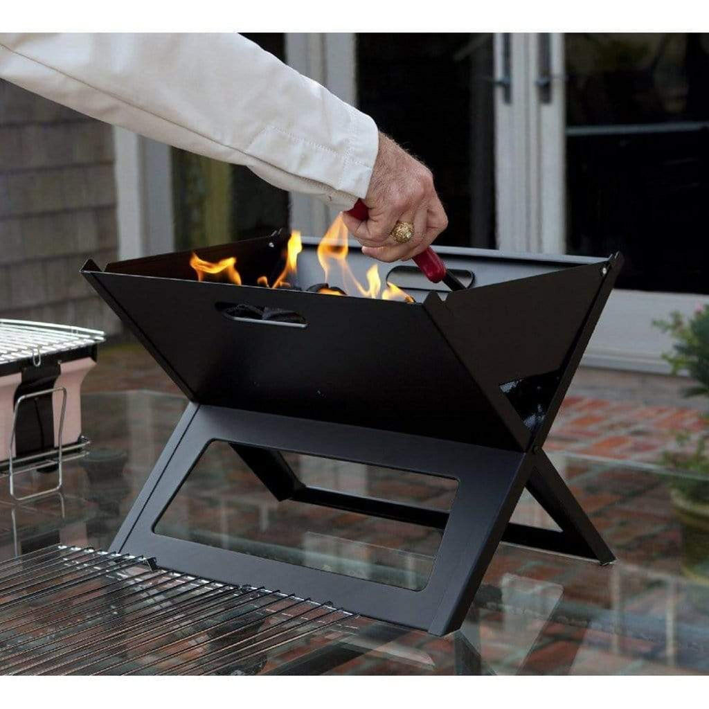 Fire Sense Notebook portable charcoal grill folded open on a table – view 5